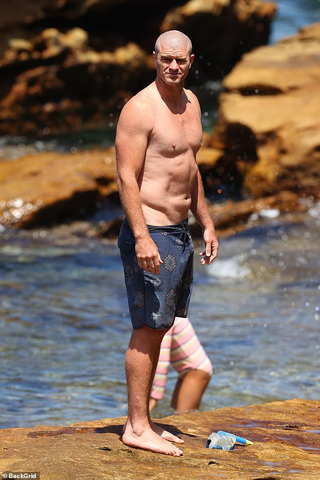 Matt stripped down for a dip in the ocean showing off his ripped stomach