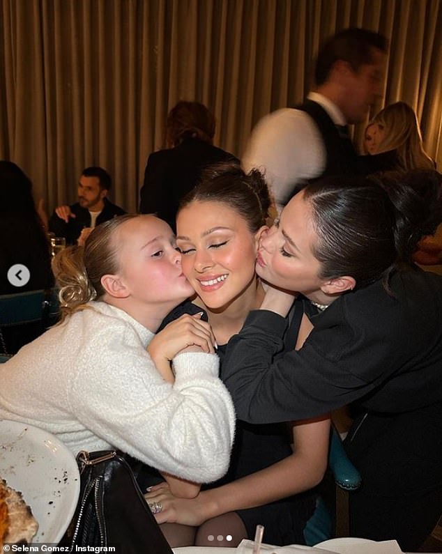 Loving: Photos showed Selena and her little half-sister Gracie kissing Nicola on the cheeks