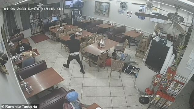 The 'gunman' heads for the door, before being shot by a customer.