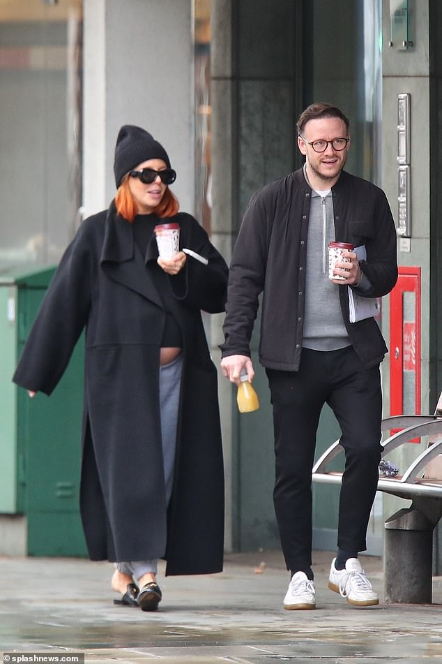 Looking good: The heavily pregnant TV host, 35, and the former Strictly Come Dancing pro, 40, coordinate casual-yet-chic figures