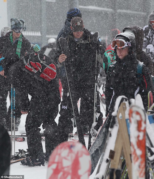 The Duke of Sussex (centre, skiing in 2011) admitted he was probably a 'bigot' before he met Meghan Markle.