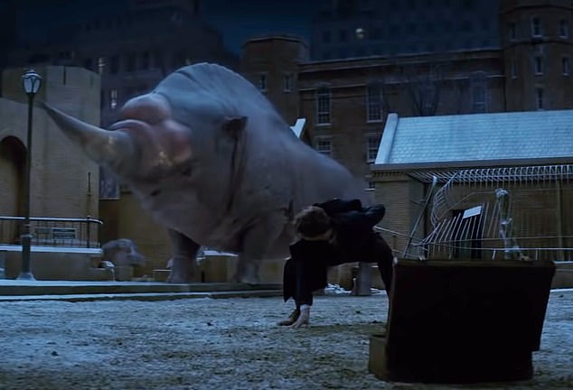 Hilarious: In a scene from the first movie, Eddie explained that he was filming a scene in which his character must perform a mating dance in an effort to distract a magical creature called the Erumpent, which looks a bit like a rhinoceros (in the photo)