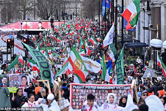 Protesters wave flags on the third anniversary of the downing of the Ukrainian airliner, Flight PS752, by the Islamic Revolutionary Guard Corps (IRGC) shortly after its takeoff from Tehran.