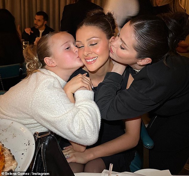 Friendship: A photo of Gracie and Selena kissing Nicola on the cheek at the party shows just how close the good friends have become in recent months