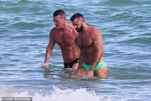 Wow: The actor, 43, and his boyfriend Fran showed off their incredibly muscular physique as they strolled along the shoreline after a dip in the sea.