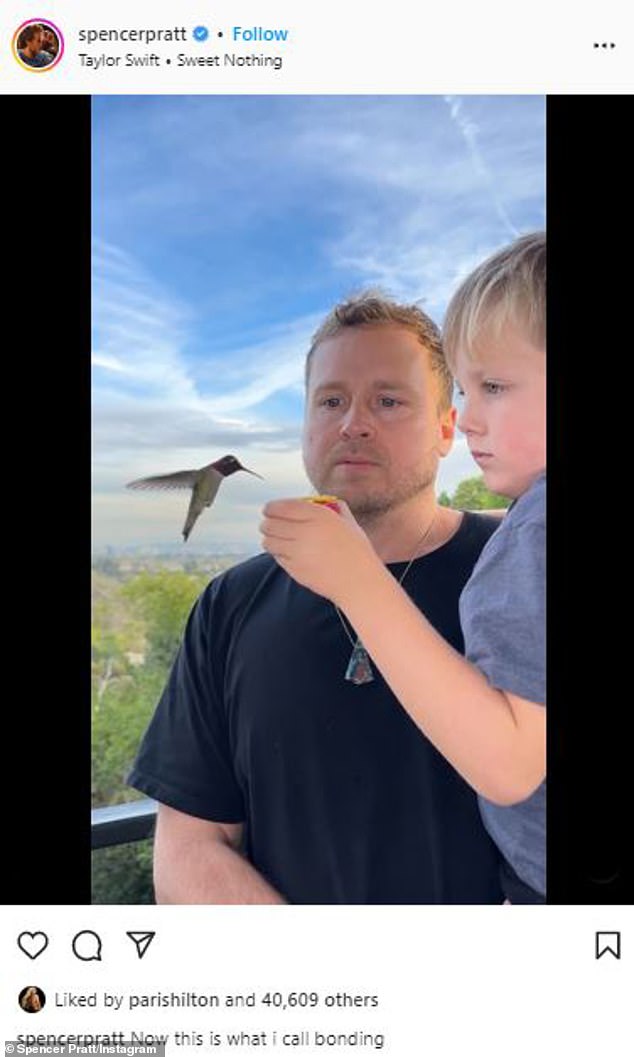 'This is what I call bonding!'  Meanwhile, Spencer posted a slow-motion video of her five-year-old son, Gunner, hand-feeding hummingbirds, staying perfectly still like his famous dad.