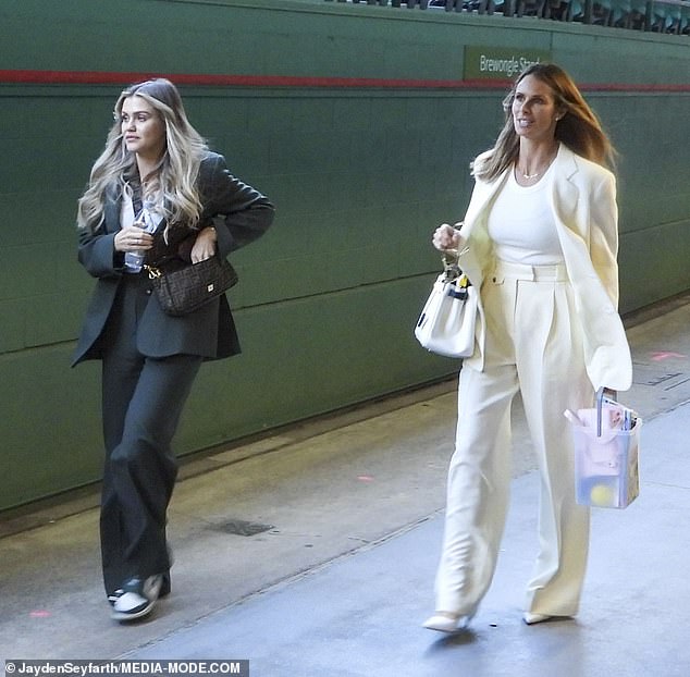 Leading the charge was slugger David Warner's wife, Candice, 37, who wore a cream blazer, matching palazzo pants and a white T-shirt.