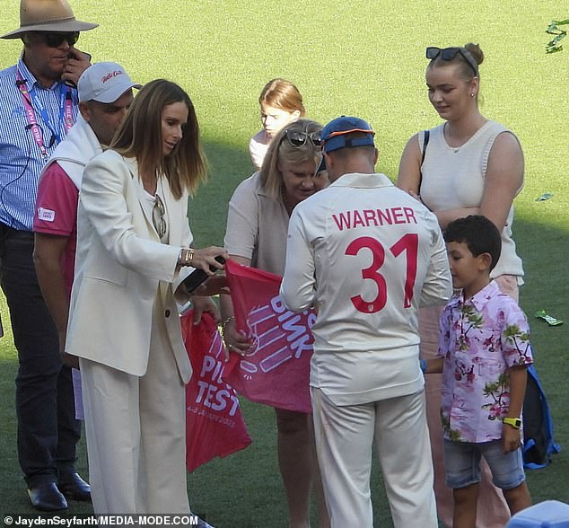 Candice was joined by daughters Ivy Mae, eight, Indi Rae, seven, and Isla Rose, three, as she celebrated with her husband on the cricket ground.