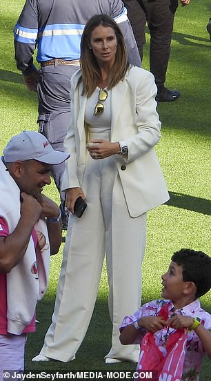 Considered the queen bees of Australia's cricket, Candice (pictured) and Emma looked glamorous as ever in chic trouser suits and designer handbags.