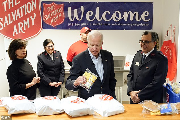 Biden looks at food being distributed to migrants as he tours the El Paso County Migrant Services Support Center in El Paso