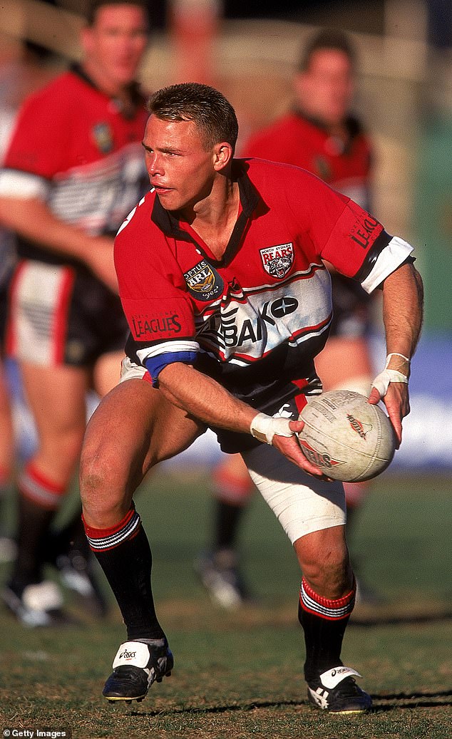 Chris Caruana of the North Sydney Bears offloads the ball during an ARL match at North Sydney Oval 1997, in Sydney