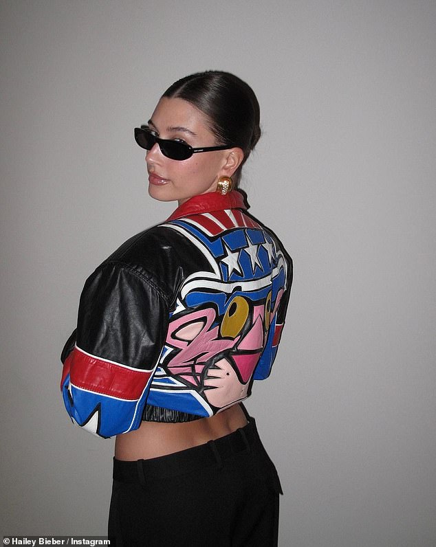 New stylish snaps: In a recent series of Instagram photos, Hailey modeled a Pink Panther leather jacket and turned her back to the camera to show off the colorful design