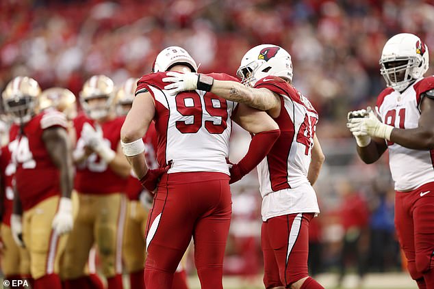 Watt is greeted by his Cardinals teammate, linebacker Dennis Gardeck, as he says goodbye.