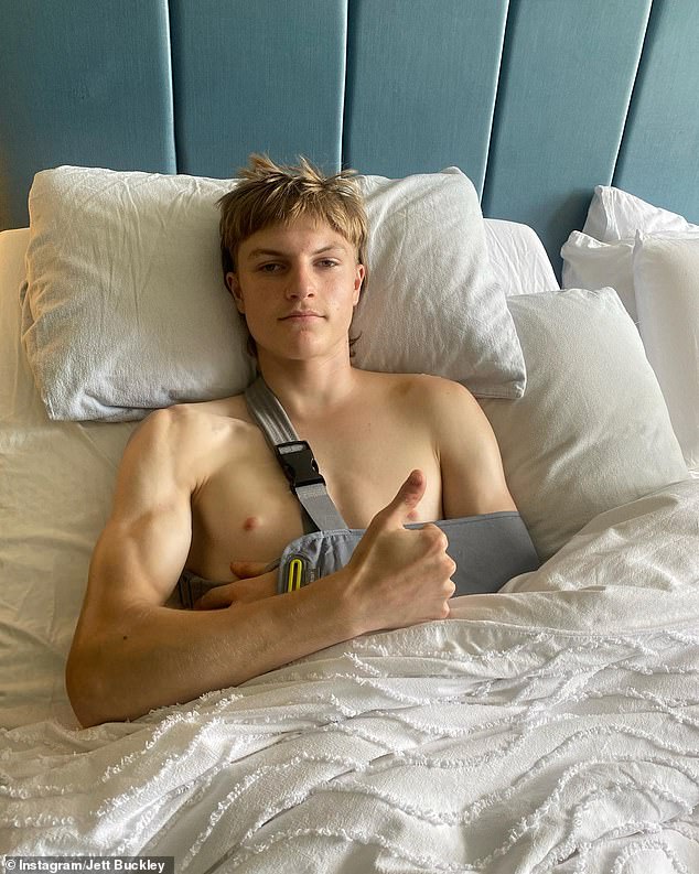 Jett Buckley gives thumbs up from his bed after being released from hospital