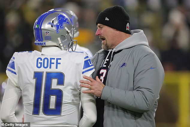 Detroit Lions quarterback Jared Goff (L) and coach Dan Campbell (R) crash the Packers party