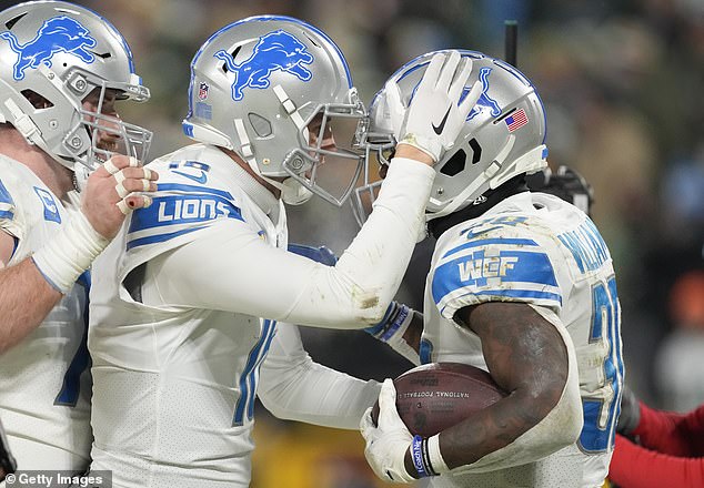 Williams (right) broke the Detroit Lions franchise record for most rushing touchdowns in a regular season