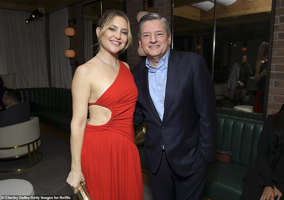 HBIC: Goldie Hawn's 43-year-old daughter made sure to pose with the big boss, Netflix CEO Ted Sarandos, at the bash.