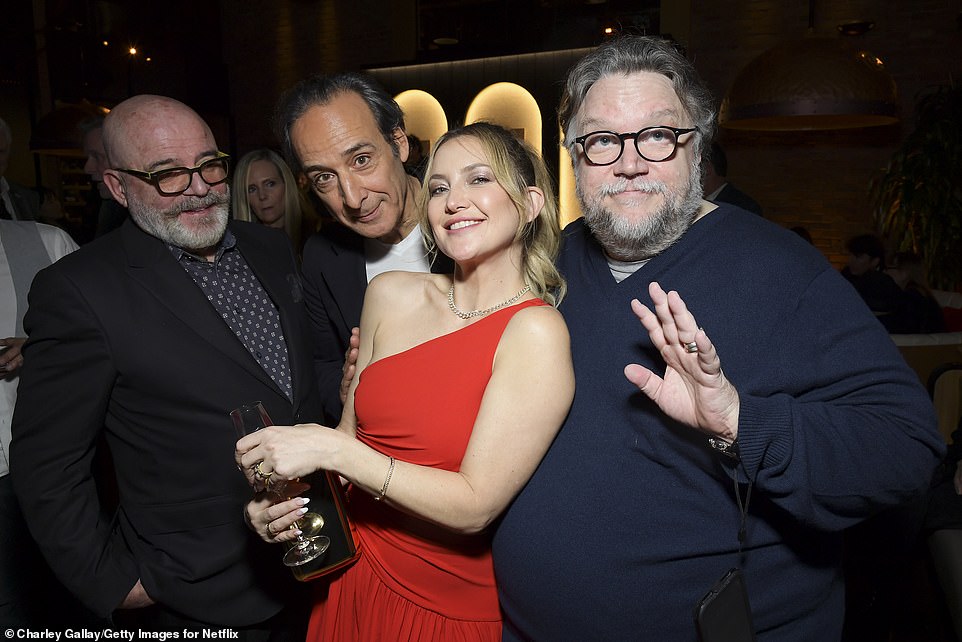 Pinocchio is also streaming on Netflix!  Speaking of Mexican masters, Oscar-winning director Guillermo del Toro (R) also greeted Hudson alongside his Pinocchio lyricist Roeban Katz (L) and composer Alexandre Desplat (2-L)