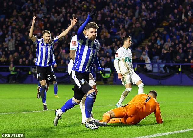 Wednesday won the game 2-1, with Josh Windass (centre) scoring the League One side's first goal