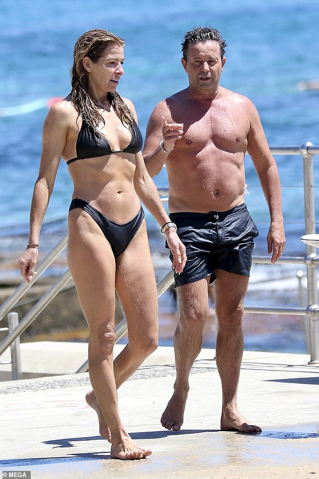 Steve and Laura, who are known to be friends, looked happy as they chatted amongst themselves as they jumped into the waves before heading out for a walk.