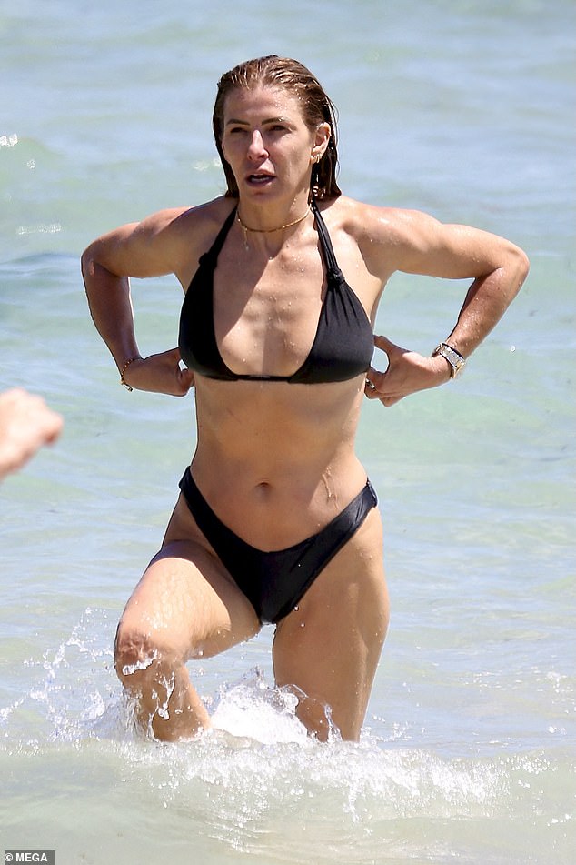 Laura looked amazing after slipping into a skimpy black bikini that showed off her flat stomach and slender pins.