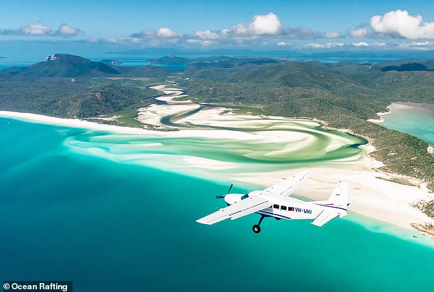 Skydiving Australia organizes dives at Airlie Beach and Whitehaven Beach (pictured)