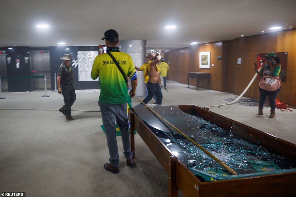 Supporters of Brazil's former President Jair Bolsonaro vandalize the interior of Planalto Palace during a demonstration