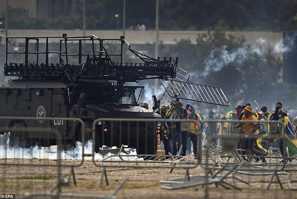 Riot police respond to the violent demonstrations against President Luiz Inacio Lula da Silva in the Brazilian capital Sunday