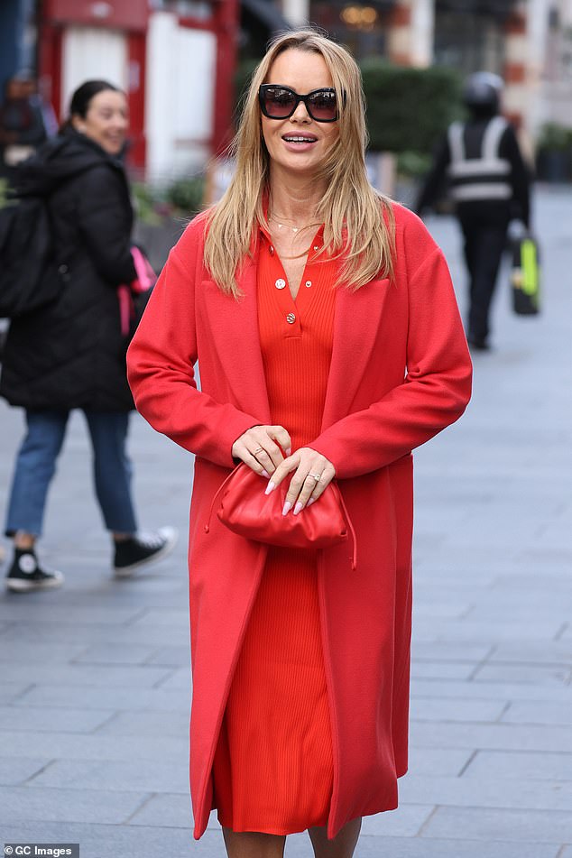 In style: The BGT judge strutted around in a fitted red pencil dress and matching long coat after hosting the radio station's breakfast show