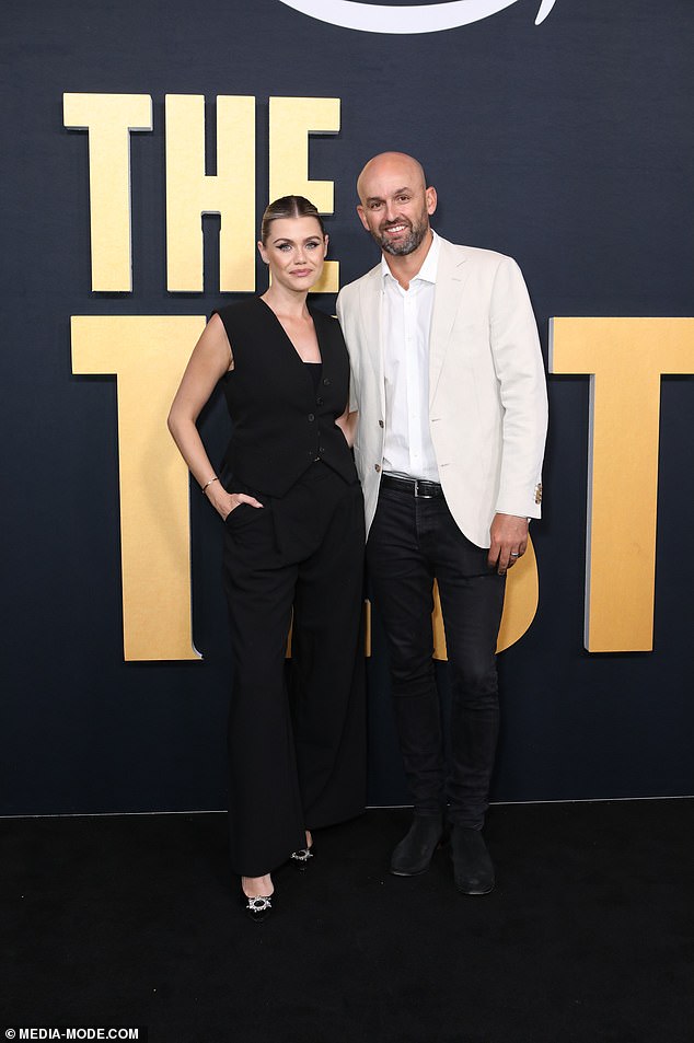 Emma Lyon looked flawless as she posed in an all-black ensemble that included black pants and a sleeveless blazer.  Pictured here with Nathan