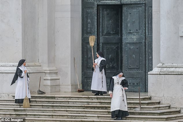 More Characters: Extras dressed as nuns were also brought into position for the scenes.