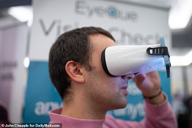 His heart-shaped eyes can see in the dark, so if anything is amiss he can alert staff and send them a live video. Pictured: Ennals with the Eyeque eye test