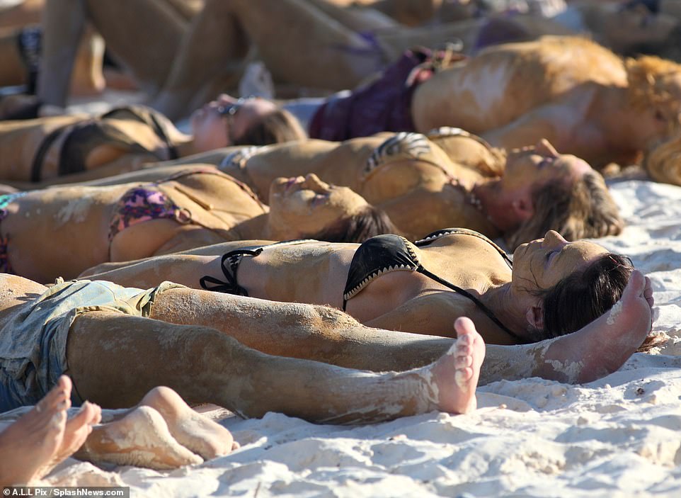 The latest trend in Tulum: The reality TV siren closed her eyes while sunbathing with the mud thick on her skin