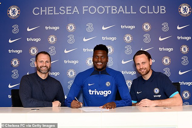 Paul Winstanley (left) and Christopher Vivell (right) pictured with Chelsea signing Benoit Badiashile