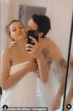 Cozy: In an instant, Brooklyn was seen planting a kiss on Nicola's cheek while she had a towel wrapped around her in the bathroom at her house