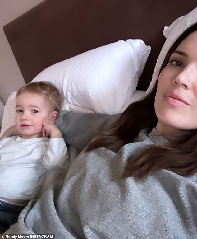 Cuddle time: The Grey's Anatomy alum also shared a photo with her eldest son, Gus, who turns two in February