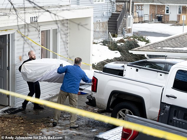 Investigators were photographed removing one of the mattresses from the crime scene on Friday.