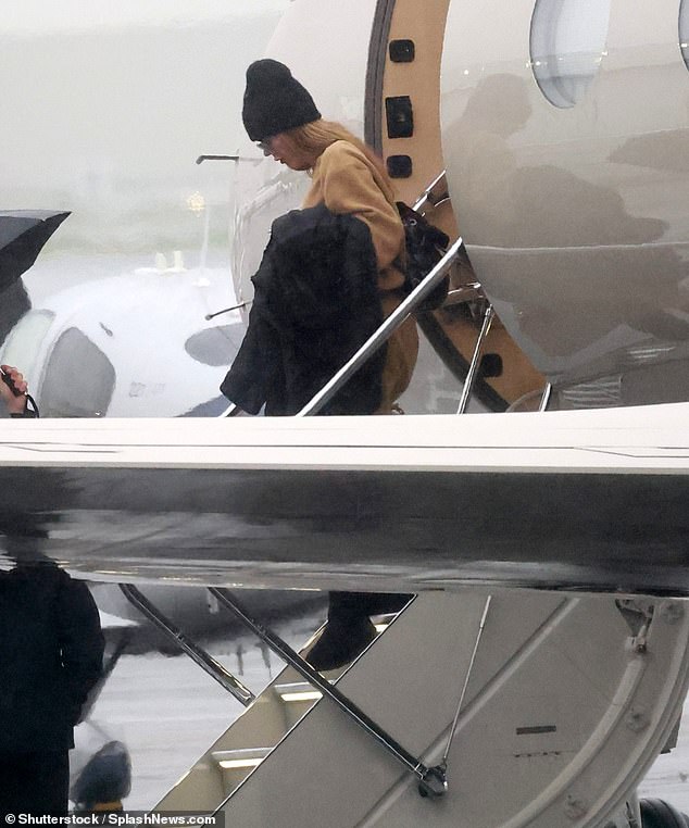 Back home: Khloe landed back in the rain in Los Angeles after supporting her ex Tristan