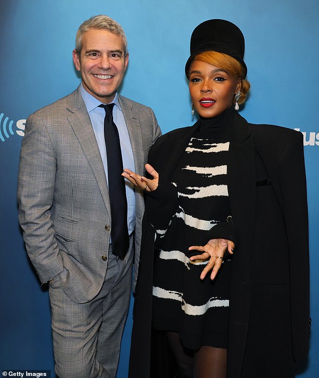 Radio Show Appearance: As accessories, she wore a black top hat over her strawberry blonde hair tied into a low bun;  posed with Andy Cohen