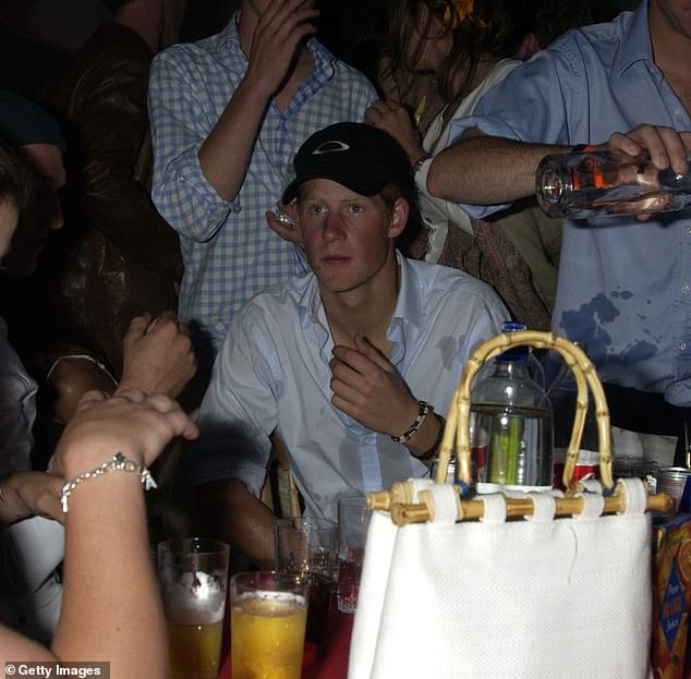 Harry's admission in his memoir 'Spare' that he has used cocaine 'a few' times has sparked renewed interest in a long-standing rumor that he once said, 'Hello, Grandma', before inhaling a line of coke.  The British banknotes depict his late grandmother, Queen Elizabeth II.  (Pictured: Prince Harry partying at the Guards Polo Club in Windsor on July 25, 2004)