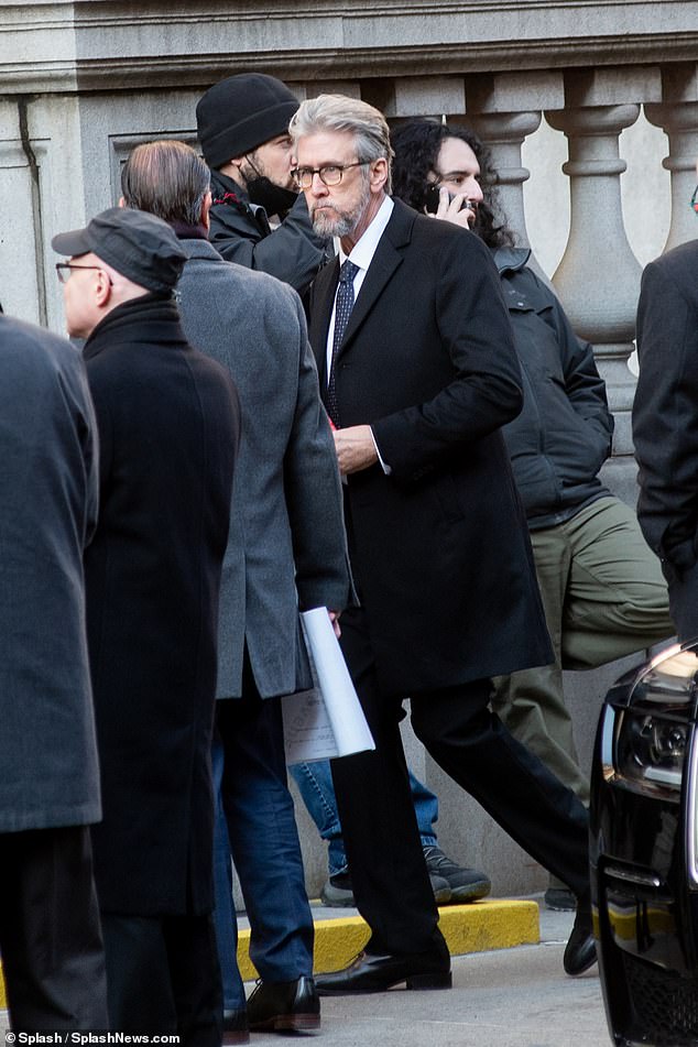 Alan's Appearance: Ruck was seen sporting horn-rimmed glasses and a gray beard with a classic black suit and black coat.