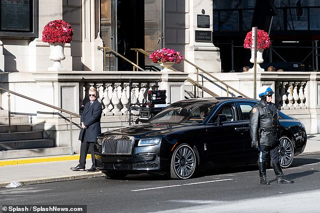 Guard: Security guards one of the cars used for filming in Succession Season 4