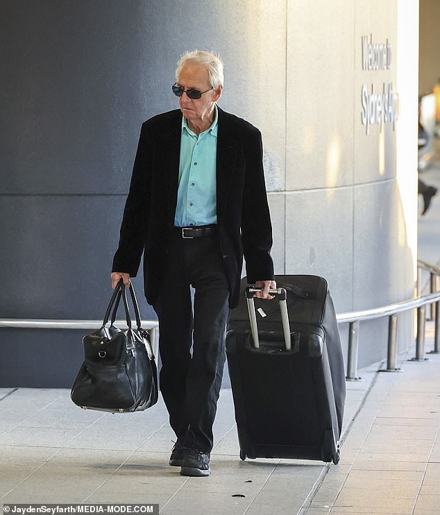 Hogan, famous for his hard-hitting appearances in the popular film franchise, was wearing black pants, a bright blue button-up shirt and a black blazer when he checked in for his flight.