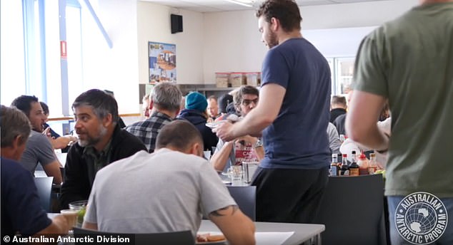 Workers eating at the Casey Station lunchroom.  Staff tend to be male with 82 percent male and 18 percent female registering this season