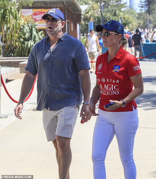 Her husband Mike, 44, opted for cream shorts and a relaxed blue shirt with matching white sneakers and a Magic Millions cap.