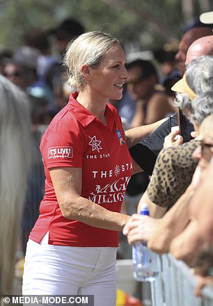 Zara is pictured shaking hands with fans after her walk on the beach.