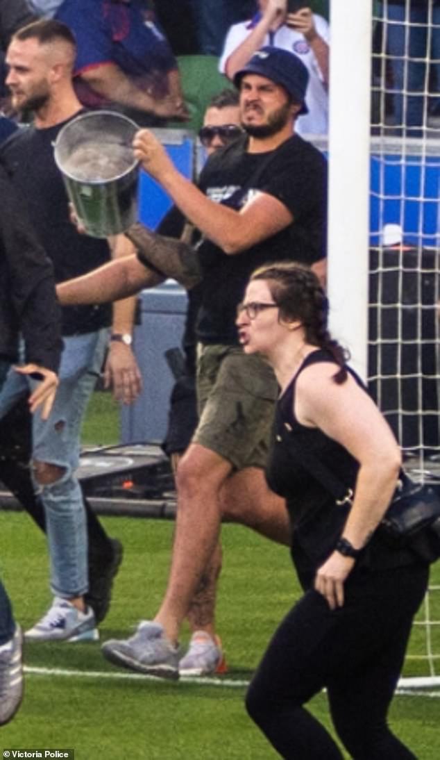 Melbourne Victory have been slapped with a record financial penalty and a host of other tough measures by Football Australia after some of their unruly supporters invaded the pitch during the derby against Melbourne City on December 17 (pictured)