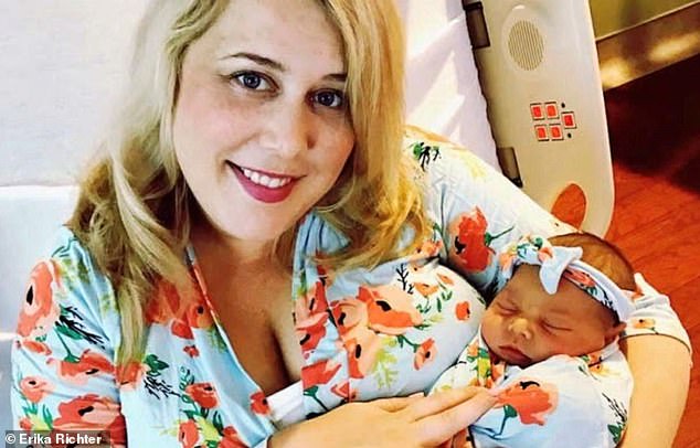 Erika Richter, from Oregon, holds her newborn daughter Emma in 2018, who also died