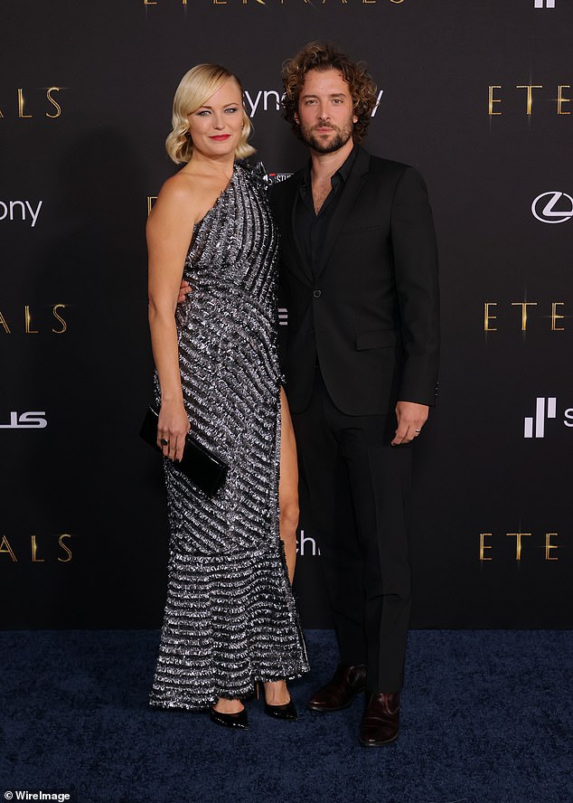 Years together: His better half donned a black blazer over a pink T-shirt.  She added black pants and matching shoes to his outfit (pictured in 2021)