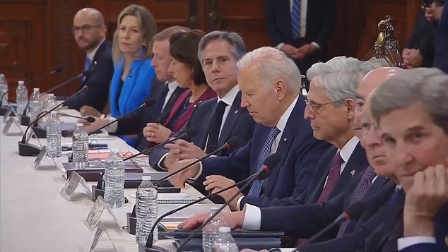 Biden looks at his briefing files Monday in Mexico City as a reporter yells out a question about classified documents found in the Washington DC offices of his think tank.  Antony Blinken, the Secretary of State, looks up as the press team exit